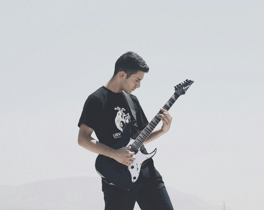 man holding guitar
