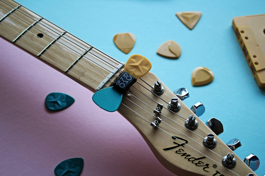 brown and black guitar pick