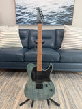 Spira T-450 TDB by Palm Harbor Music, a sleek black electric guitar with a modern design, shown with its body and neck visible.