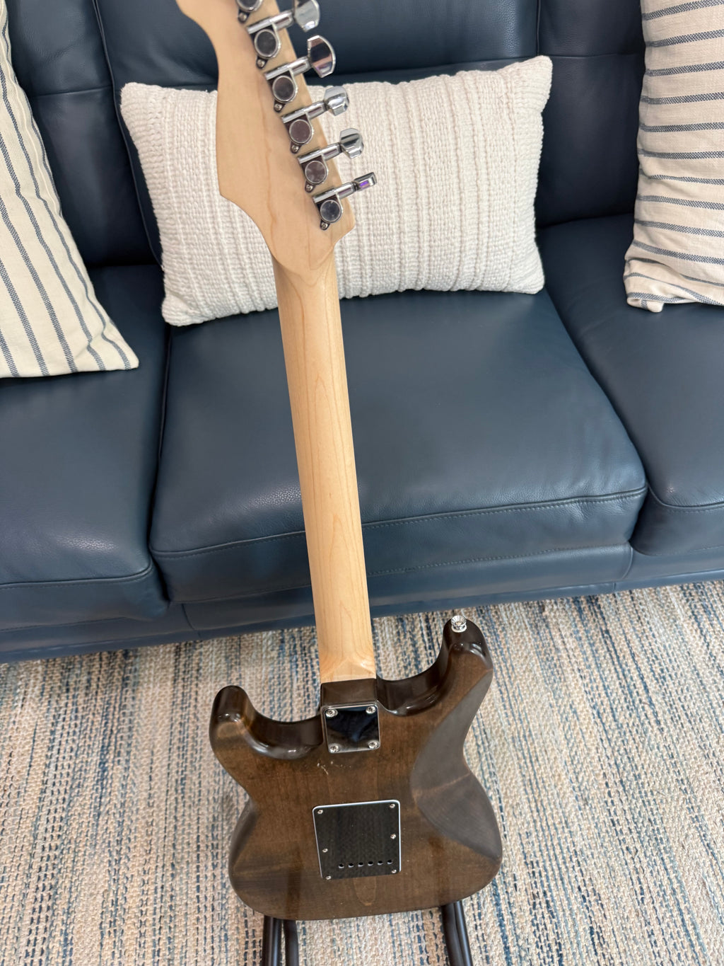 Ozona Guitar Works Suncaster US Aged Series 1-piece brown alder guitar body with aged finish and smooth wood grain details.
