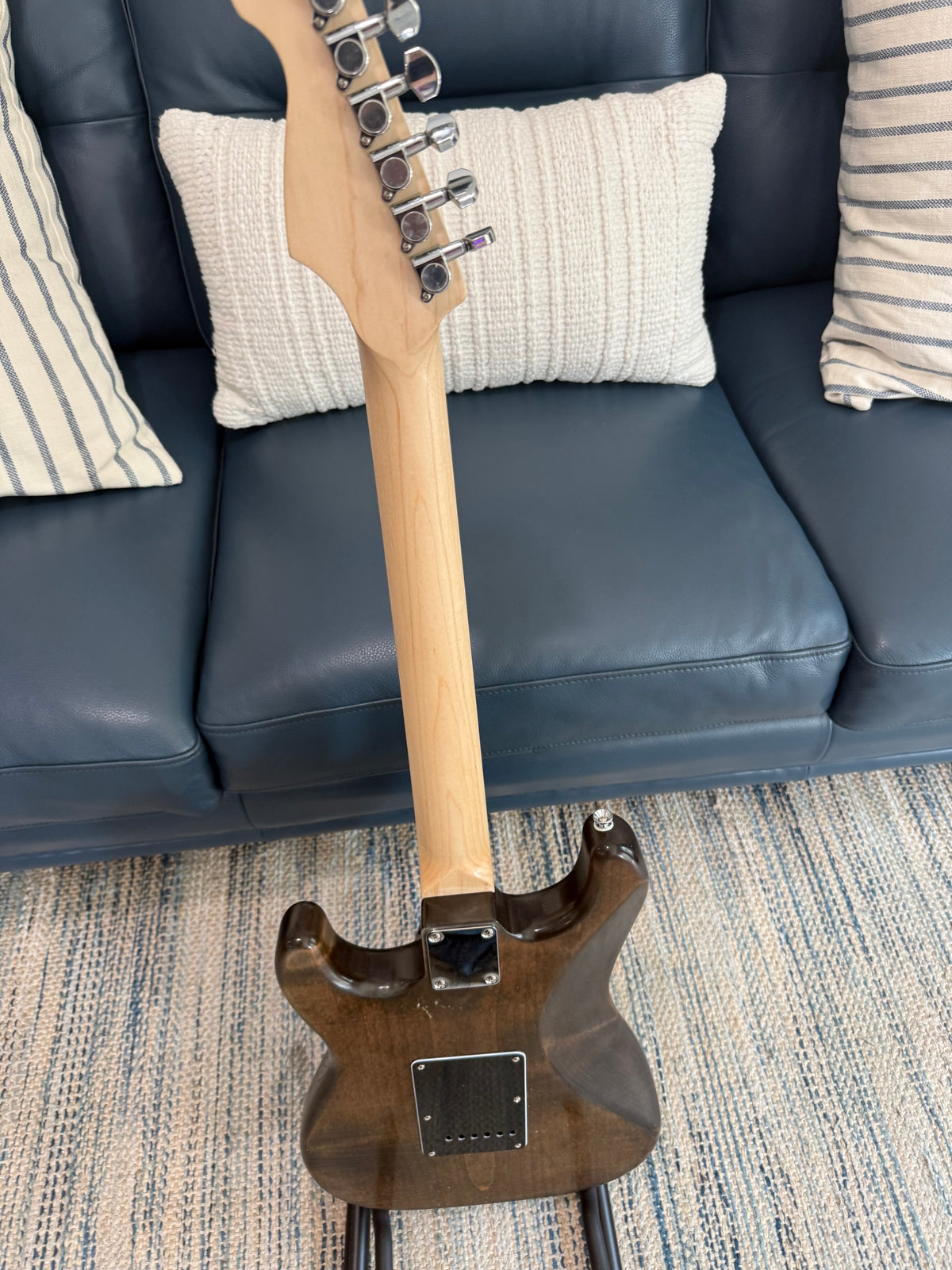 Ozona Guitar Works Suncaster US Aged Series 1-piece brown alder guitar body with aged finish and smooth wood grain details.