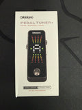 Chromatic pedal guitar tuner by Palm Harbor Music featuring a compact design and colorful display for accurate tuning.