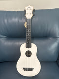 White Flight TUS-35 travel soprano ukulele with glossy finish and compact size, ideal for travel and beginner musicians.