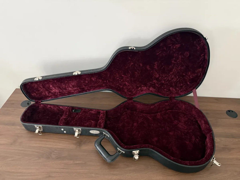 Used Alvarez hollow body electric guitar hardshell case with a sturdy exterior and plush interior for protection.