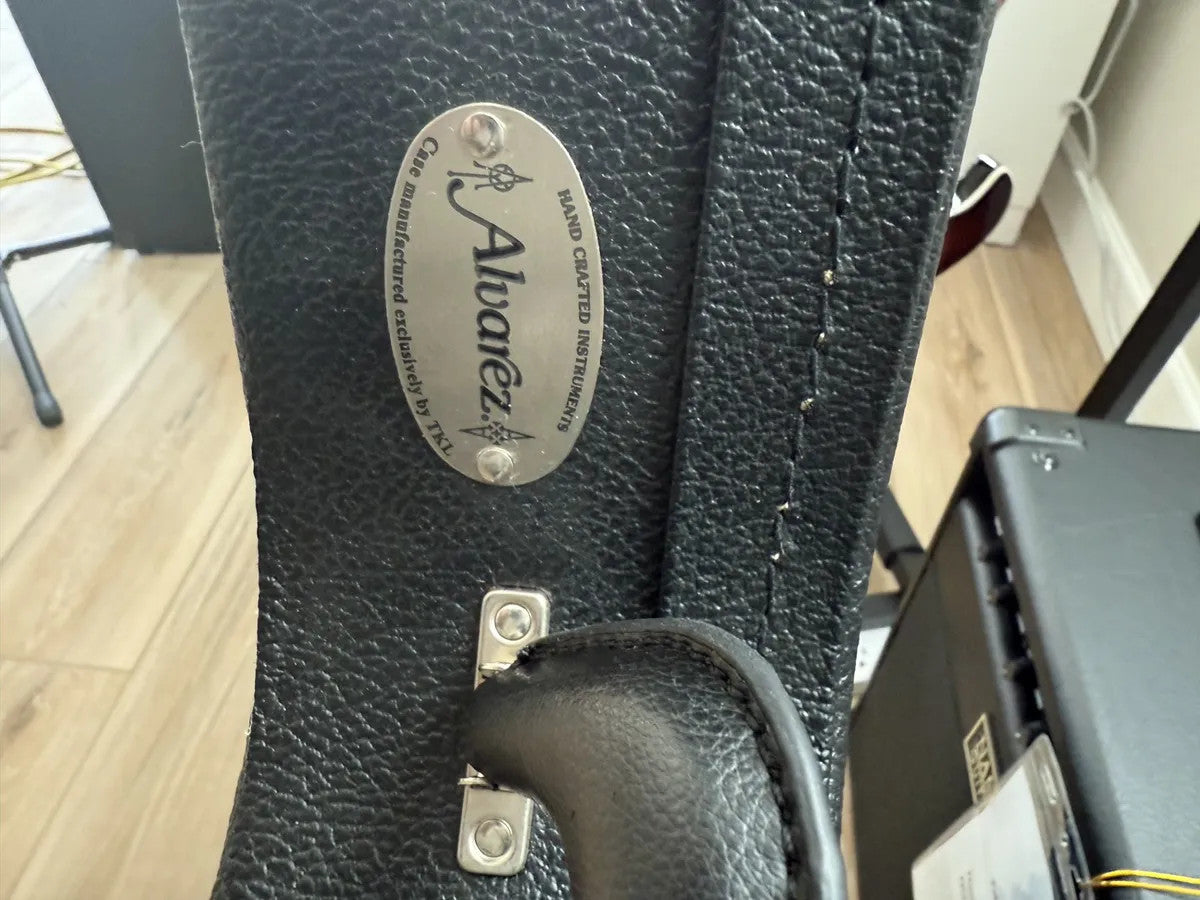 Used Alvarez hollow body electric guitar hardshell case with sturdy exterior and soft interior lining.