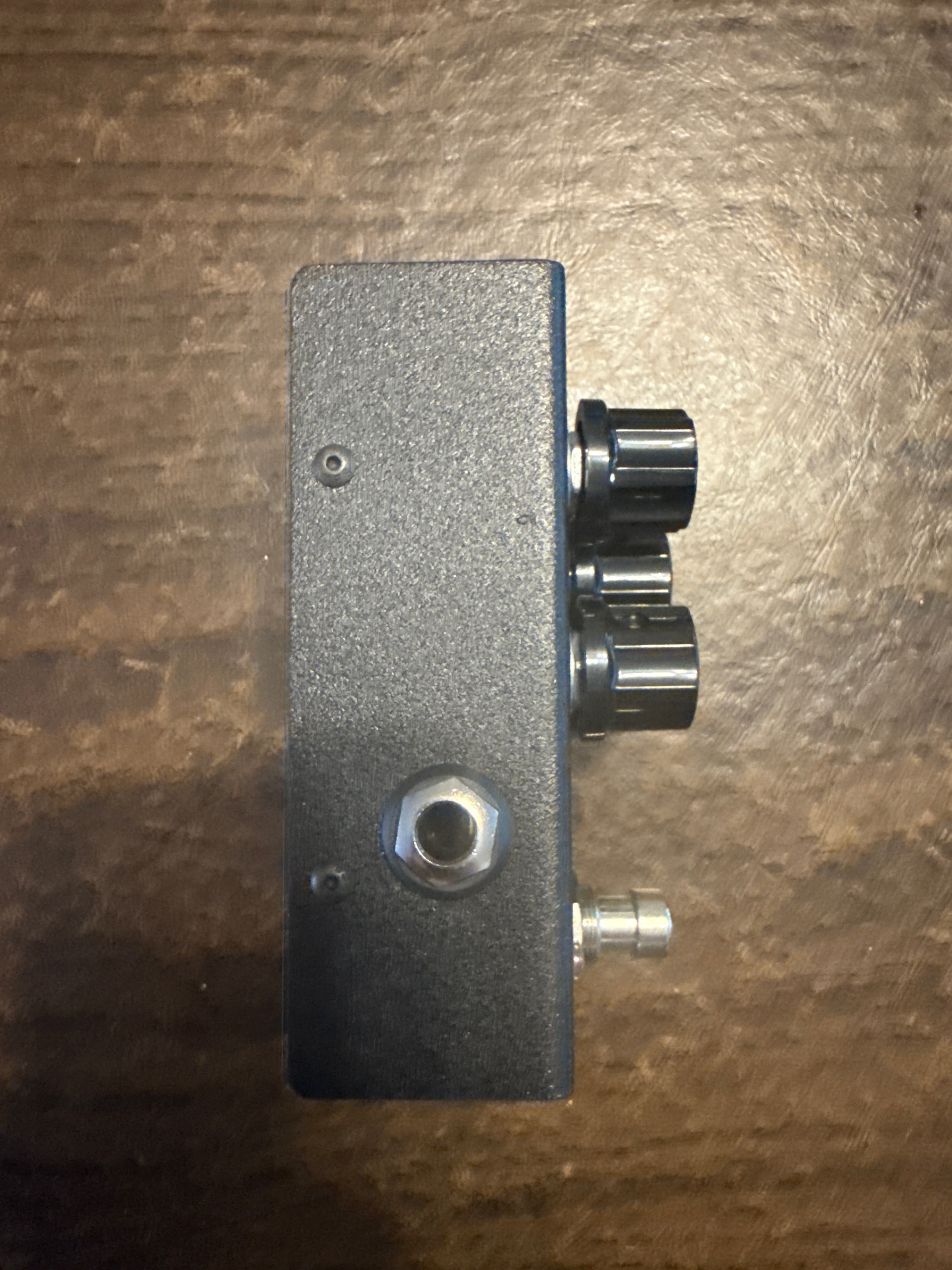 Cerberus Javelin Modern Distortion Pedal with sleek design and knobs, ideal for enhancing guitar sound.