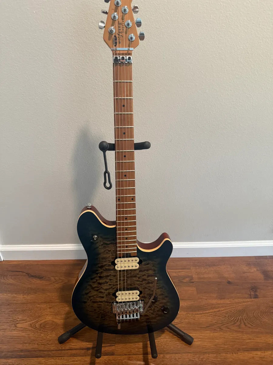 EVH Wolfgang Special guitar body in quilted maple with an indigo burst finish, showcasing its intricate wood grain.