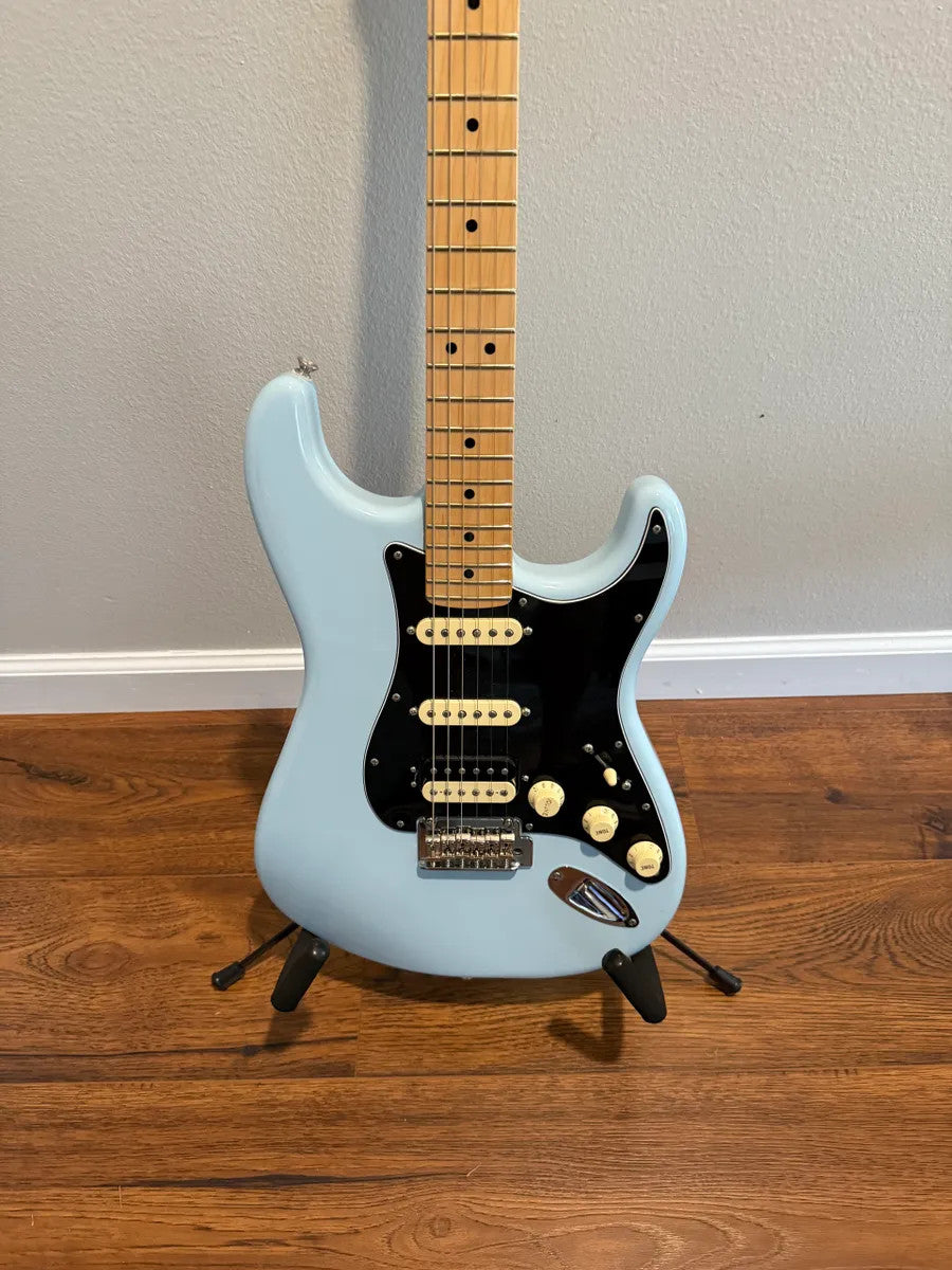 Used Fender Player Stratocaster HSS in Sonic Blue with solid body and visible pickups and fretboard details.