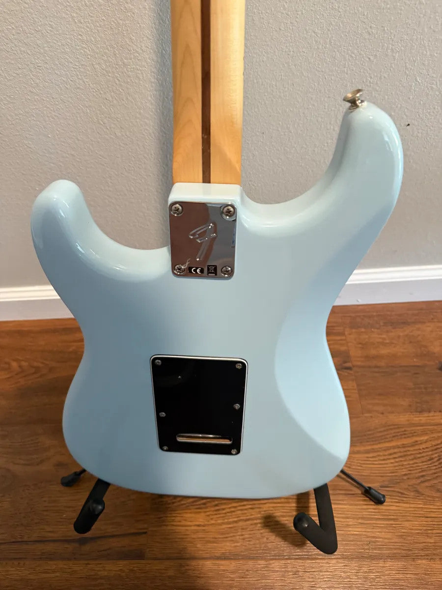 Used Fender Player Stratocaster HSS in Sonic Blue with solid body, showcasing a sleek design and classic electric guitar features.