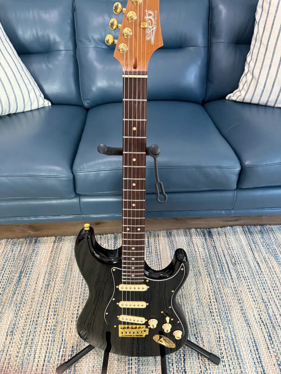 Jet Guitars JS-380 BK G electric guitar in black with sleek design and chrome hardware, angled view.