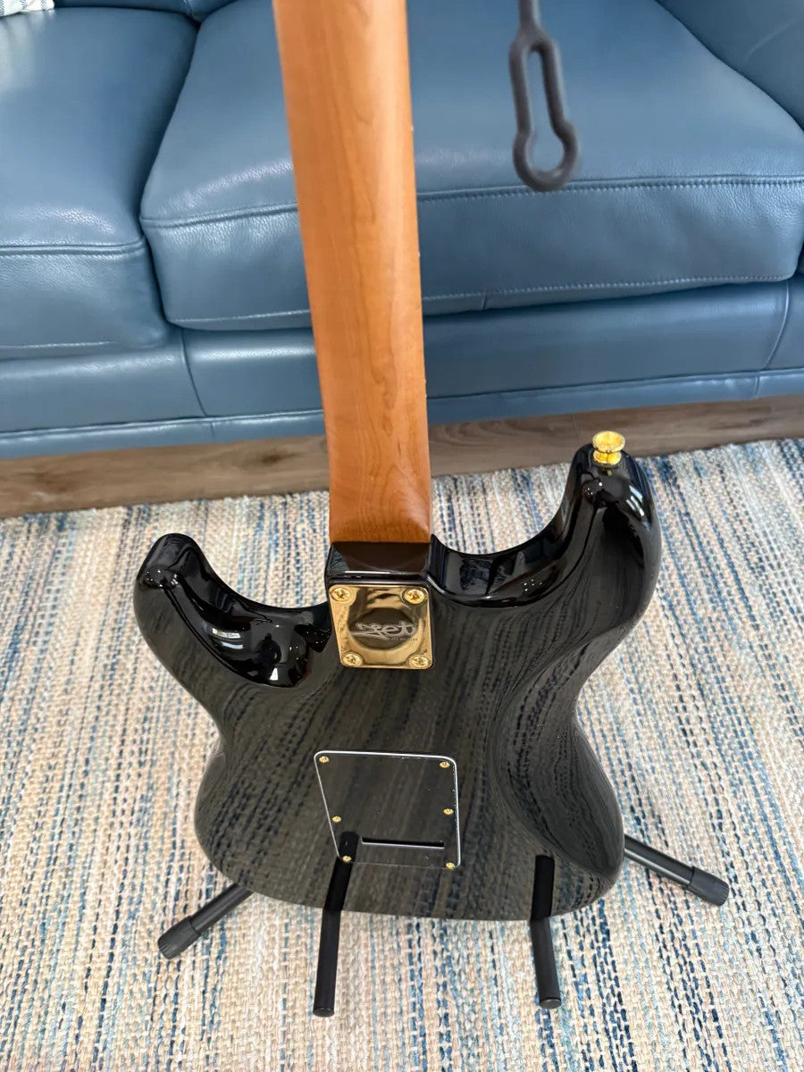 Jet Guitars JS-380 BK G, a sleek black electric guitar with a glossy finish and modern design.