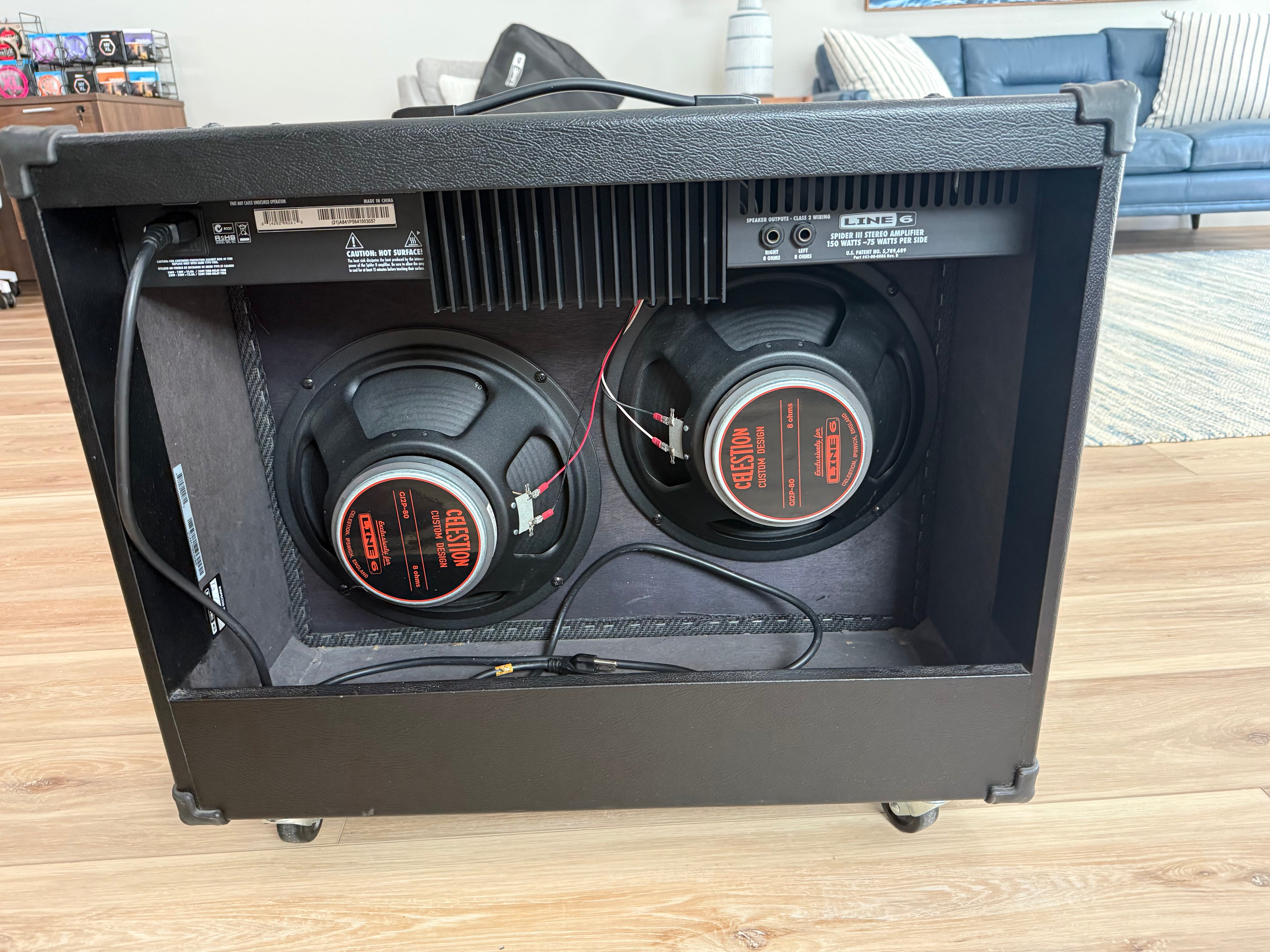 Used Line 6 Spider III 150W stereo guitar amplifier with two 12-inch speakers, showcasing its sleek design and controls.
