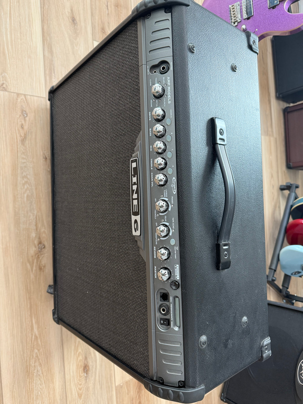 Used Line 6 Spider III 150W stereo guitar amplifier with dual 12-inch speakers in a sleek design.