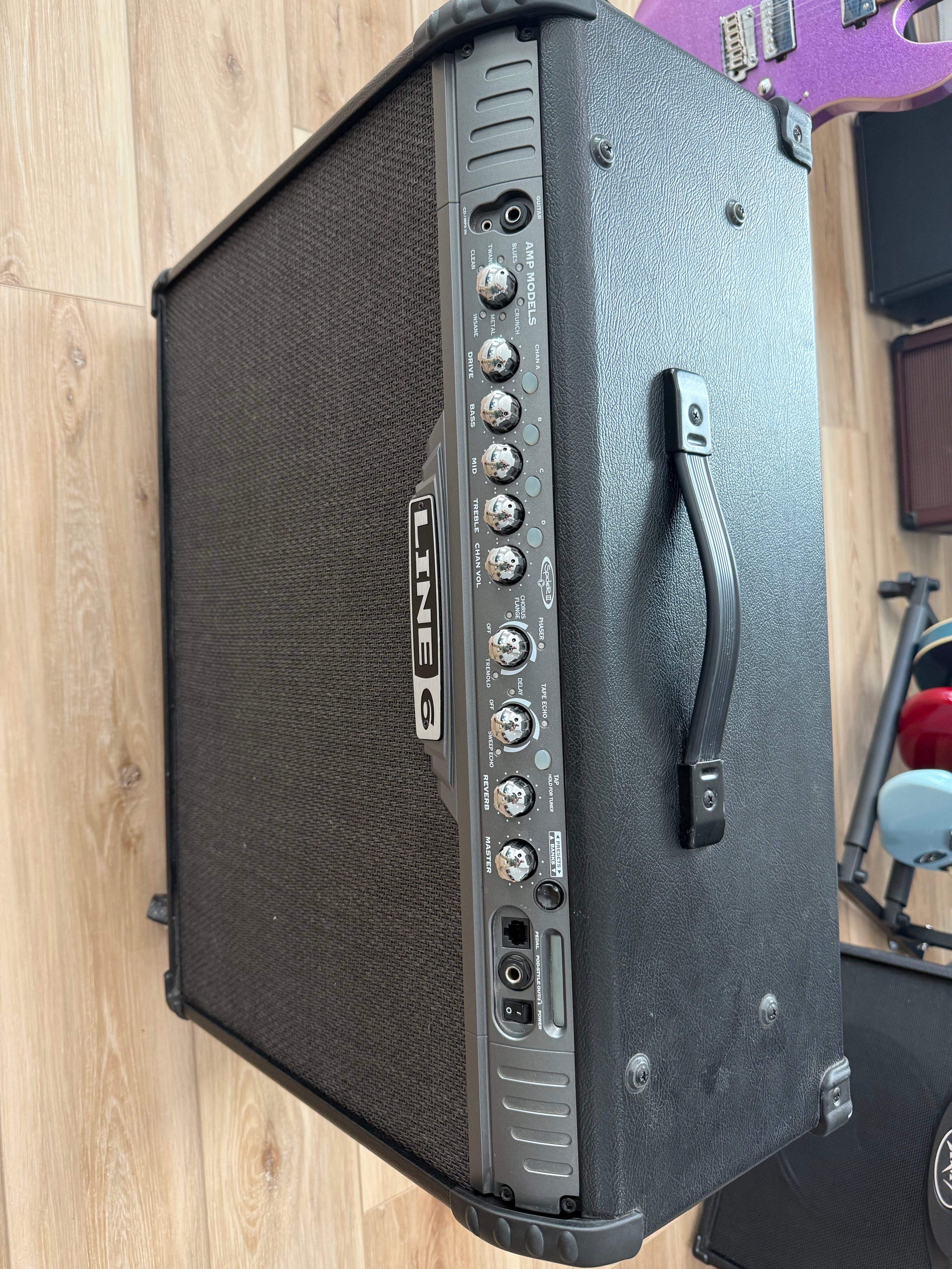 Used Line 6 Spider III 150W stereo guitar amplifier with dual 12-inch speakers in a sleek design.