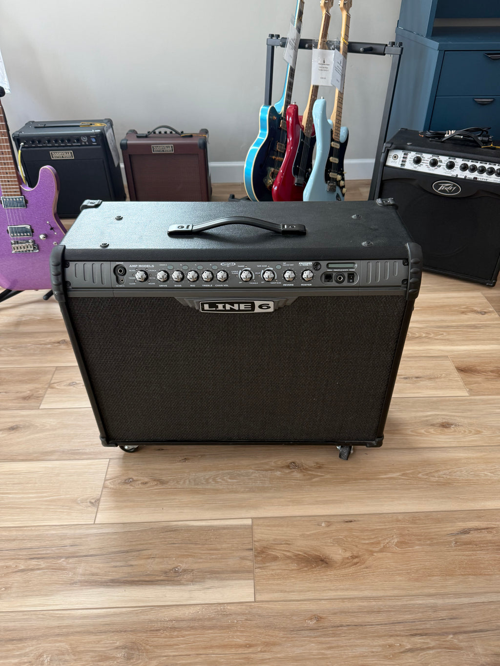 Used Line 6 Spider III 150W stereo guitar amplifier with dual 12-inch speakers in a sleek design.