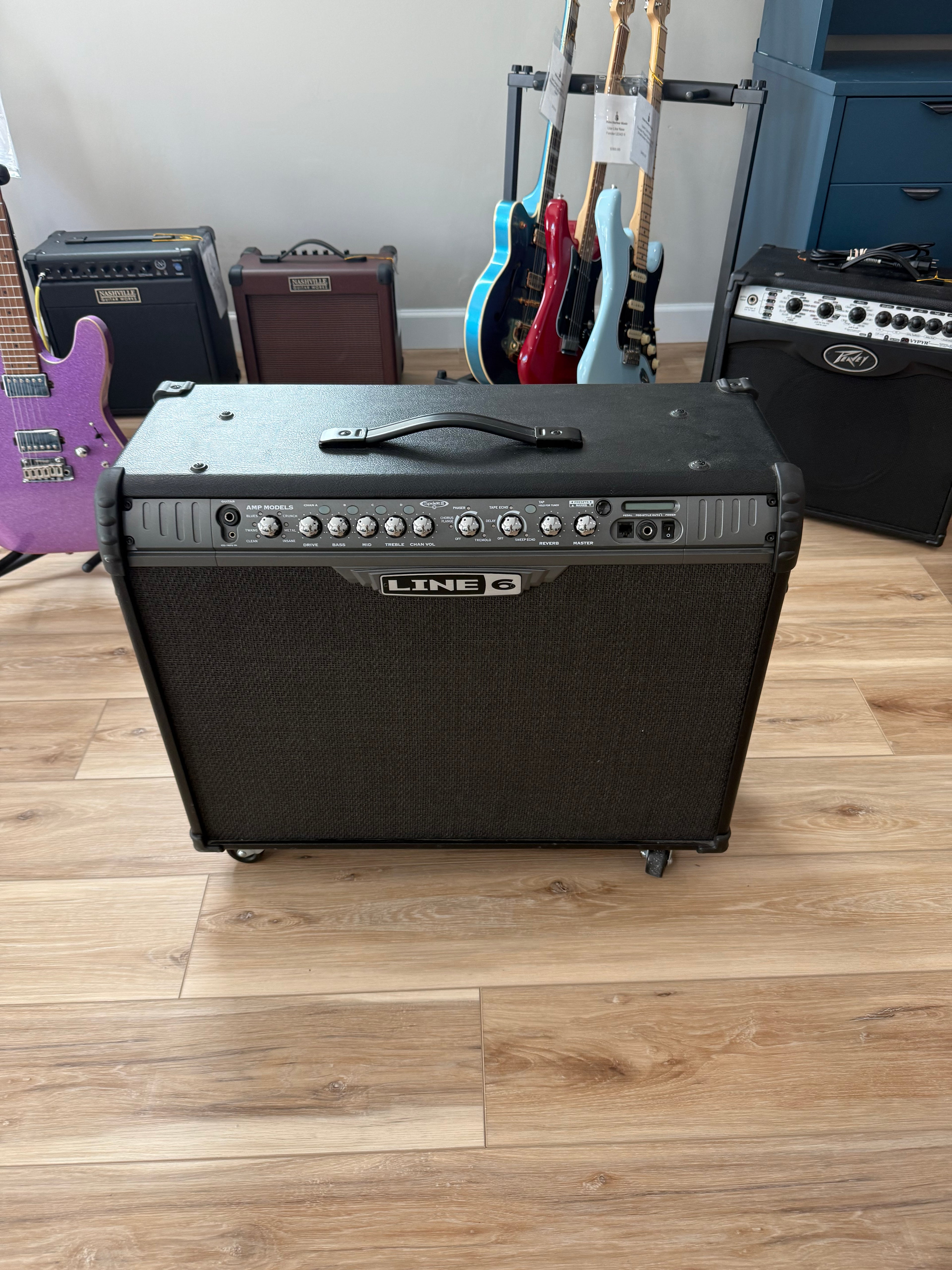 Used Line 6 Spider III 150W stereo guitar amplifier with dual 12-inch speakers in a sleek design.