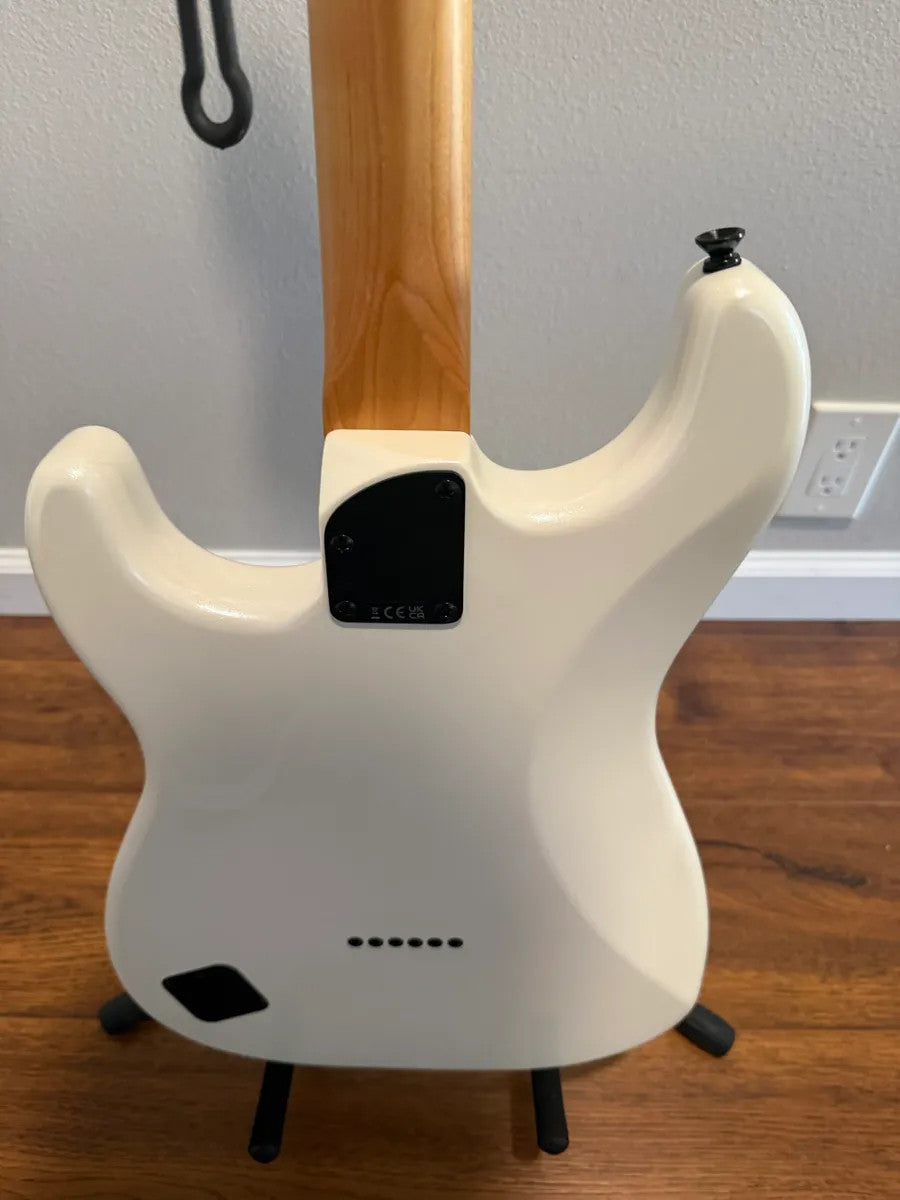 Used Squier Contemporary Stratocaster in pearl white finish, showcasing its sleek body and elegant design.