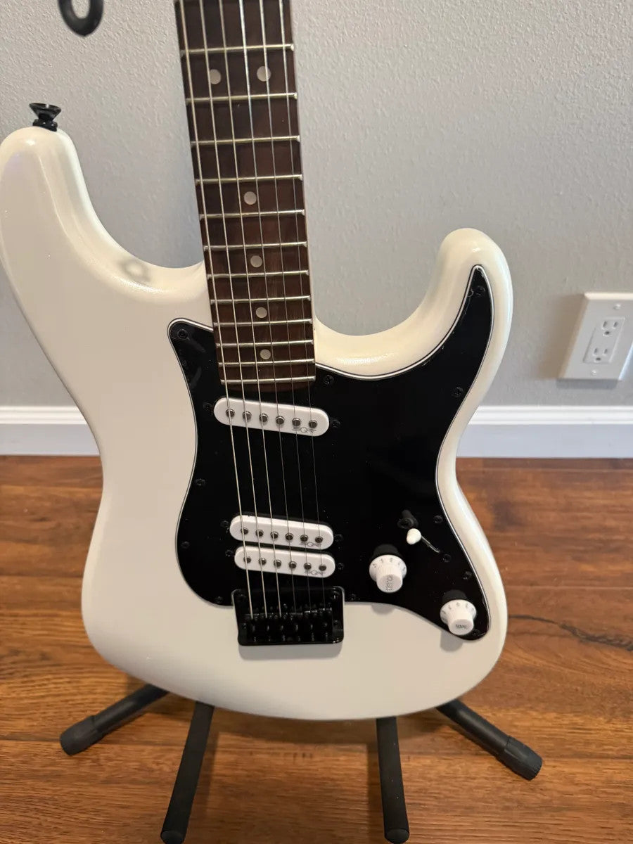 Used Squier Contemporary Stratocaster in pearl white finish, showcasing sleek body shape and polished hardware details.