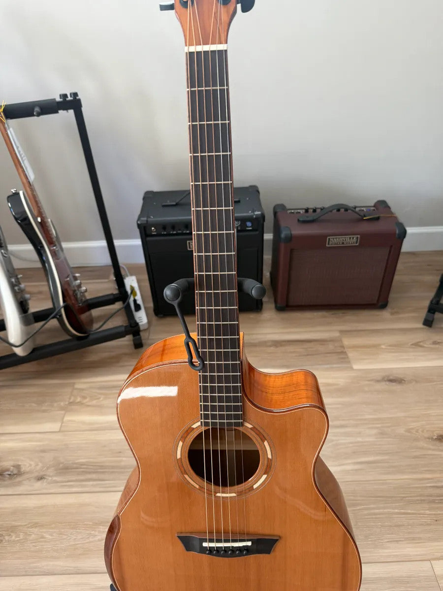 Used Washburn Comfort Series WCG66SCE acoustic electric guitar with a natural wood finish and cutaway design.