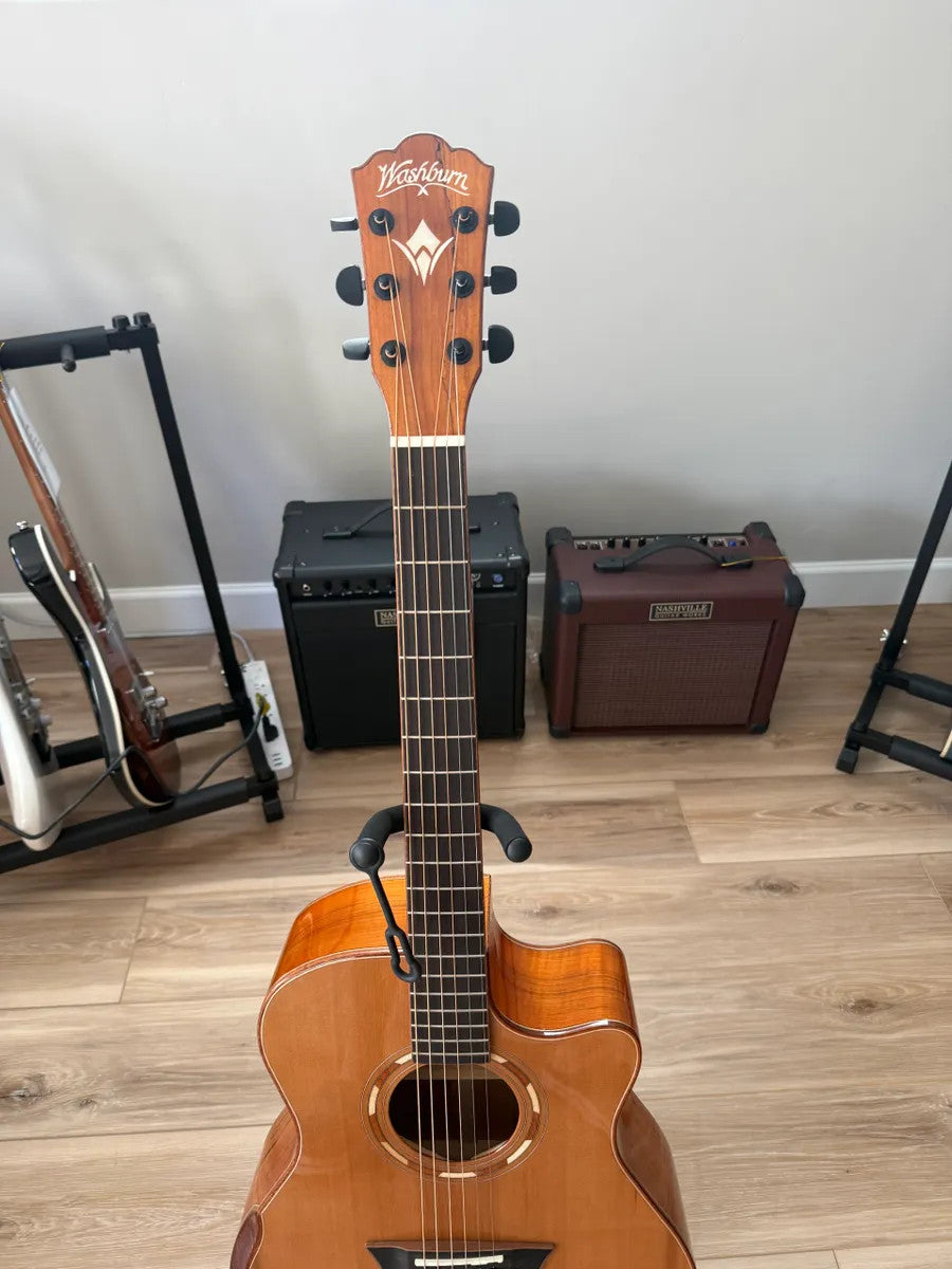 Used Washburn Comfort Series WCG66SCE acoustic electric guitar with natural wood finish and cutaway design.
