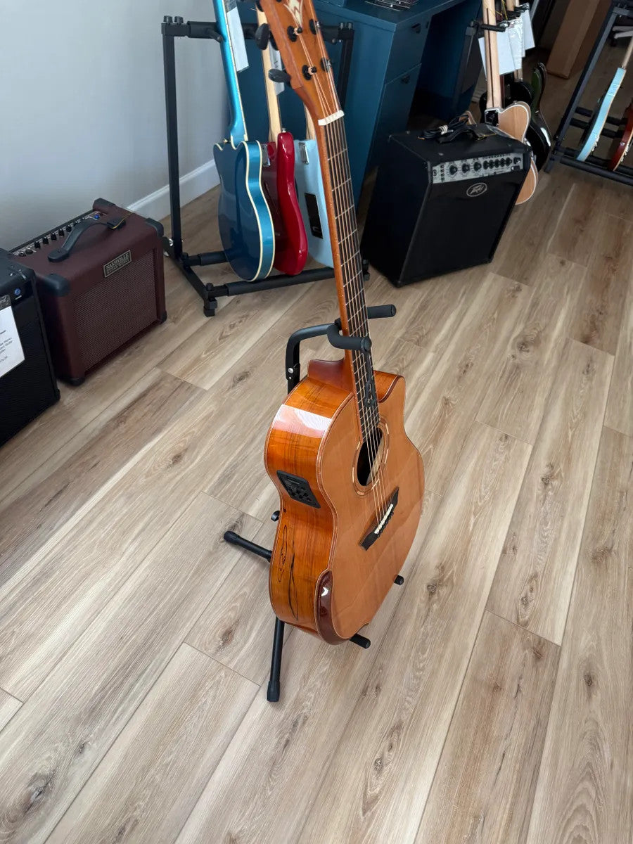 Used Washburn Comfort Series WCG66SCE acoustic electric guitar with natural wood finish and cutaway body design.