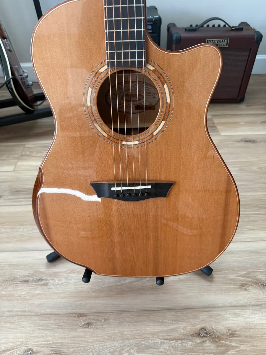 Used Washburn Comfort Series WCG66SCE acoustic electric guitar with a natural finish and cutaway design.